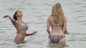 Bikini-girls-playing-ball-in-the-surf-g7c3c8wjjg.jpg